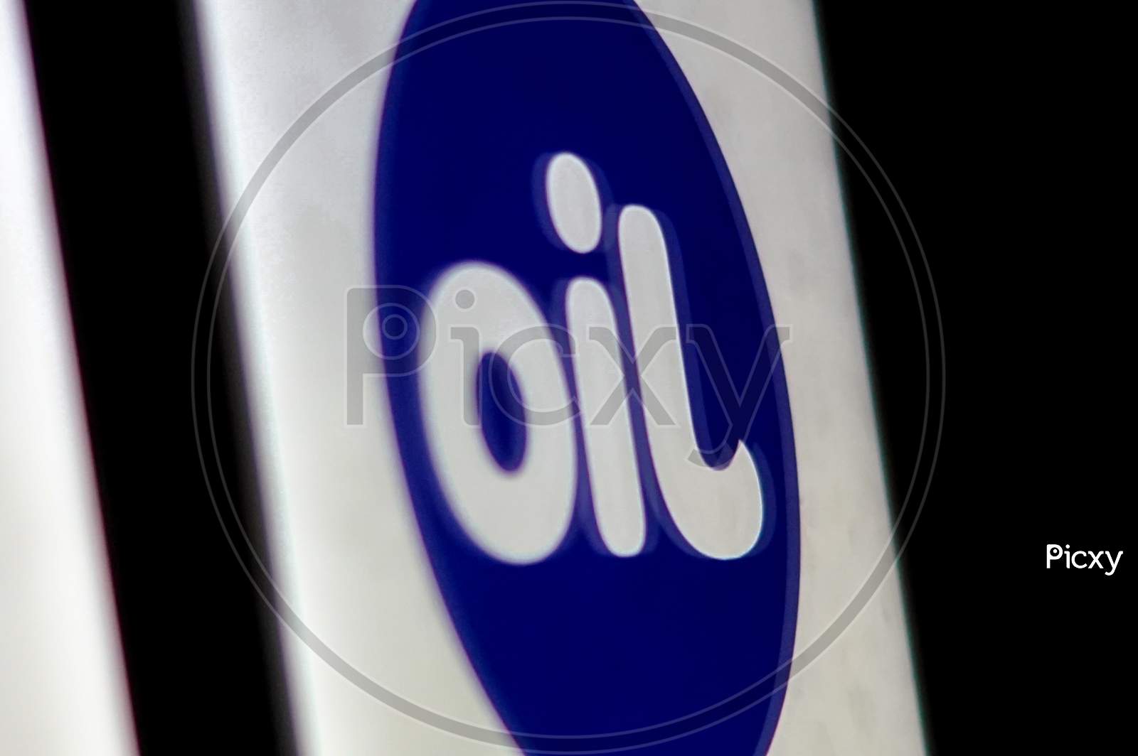 Close up shot of a Flipped Jio Logo as OIL - Concept as Data is a New Oil