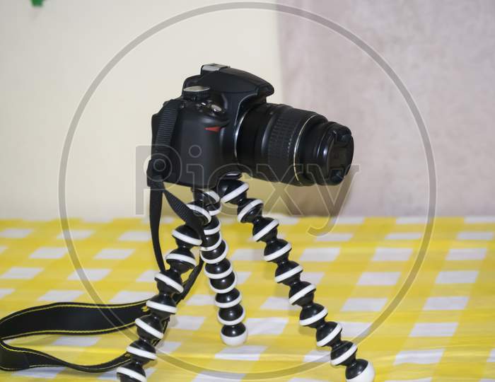 A Dslr Camera On A Gorilla Tripod