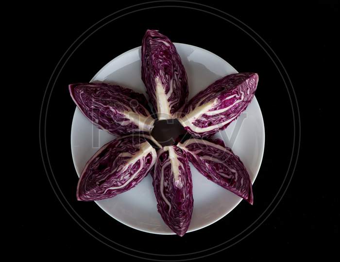 Fresh Raw And Organic Cut Violet Color Cabbage In White Plate As Texture, Background