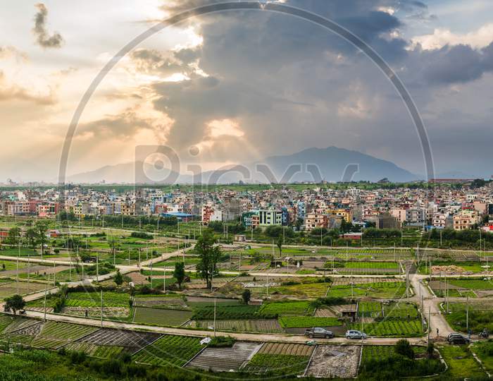 Panorama of plotted land for housing nearby dense settlement of Kathmandu. the plots of lands are cultivated with seasonal crops by local farmers.