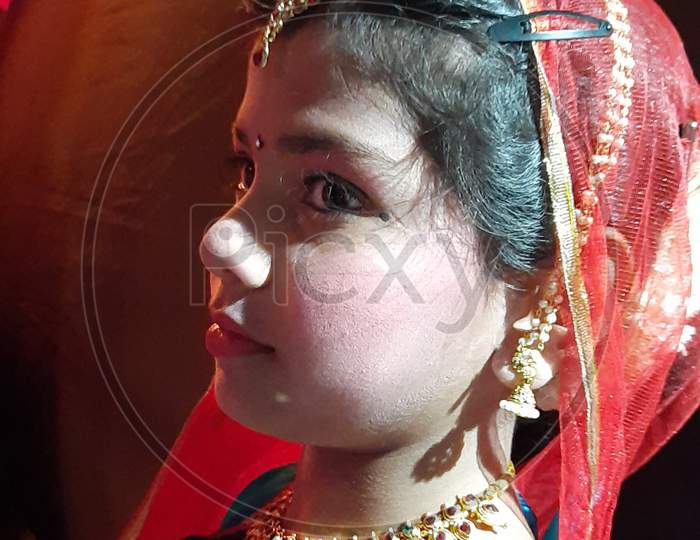 Little girl wears Dandiya dress close up shoot