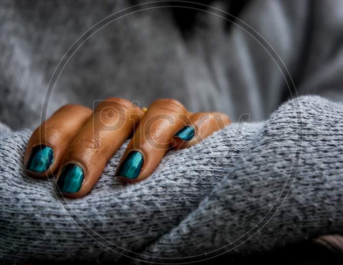 young woman's hand with nail polish