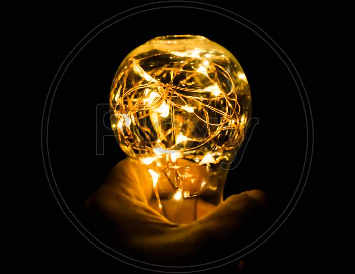 A Bulb In Hand With Nice Black Background, Technology, Energy