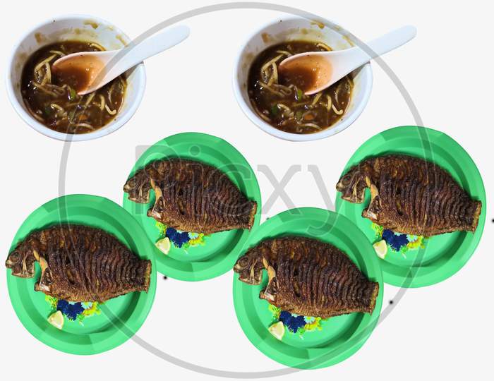 Noodles Cups And Fish Fry On Plates Is Isolated On White Background