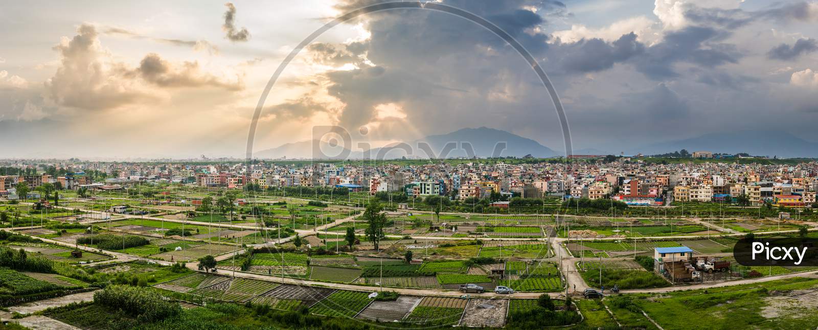 Panorama of plotted land for housing nearby dense settlement of Kathmandu. the plots of lands are cultivated with seasonal crops by local farmers.