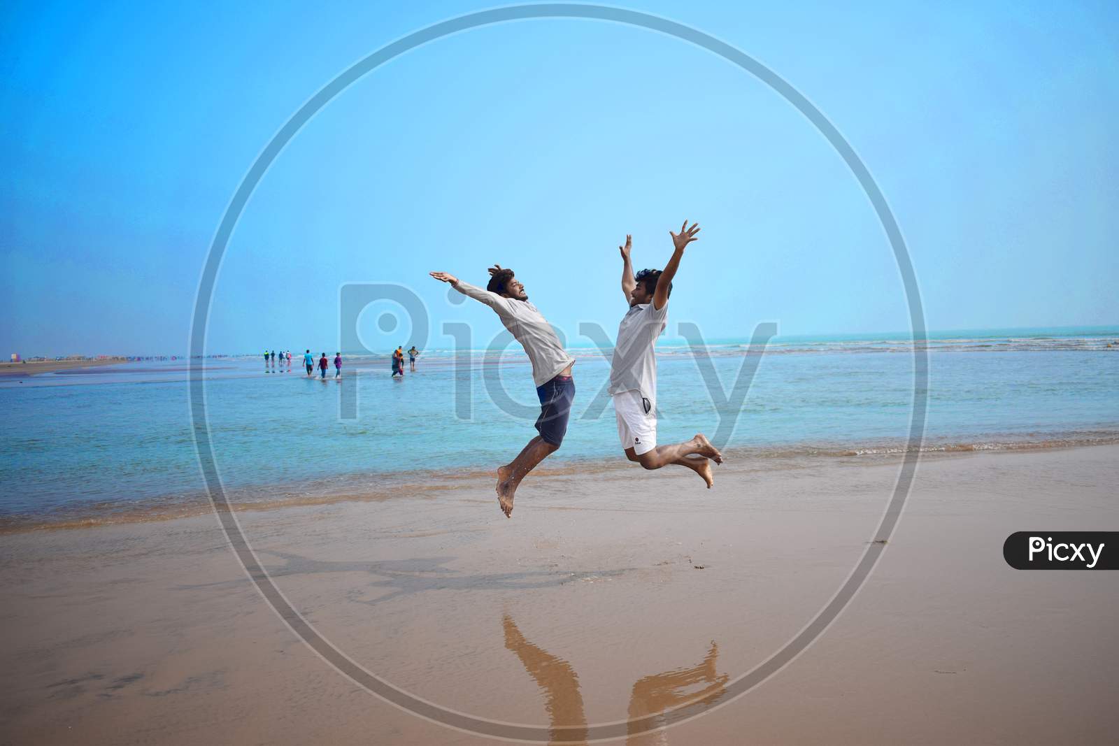 Two Friends Jumping On The Beach, Beautiful View