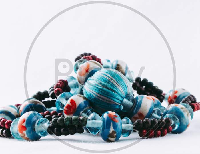 Turquoise Bead Necklace In A Crumpled Pile Isolated On White
