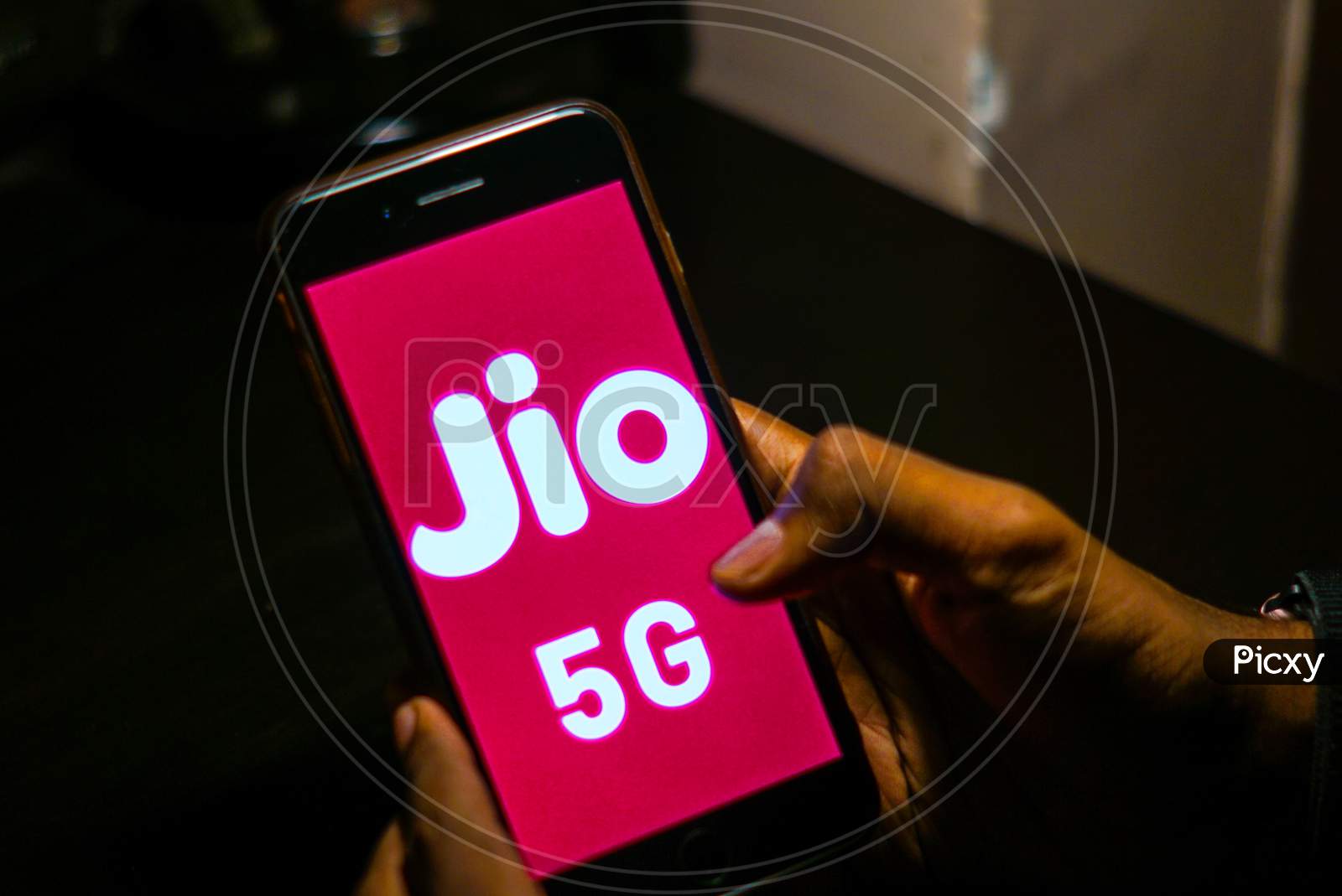 Close up shot of a Person using a Smartphone or Mobile Phone with Jio 5g on Screen