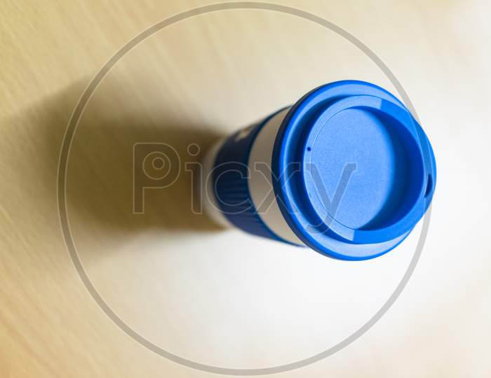 Closeup View Of A Coffee Mug On The Brown Table