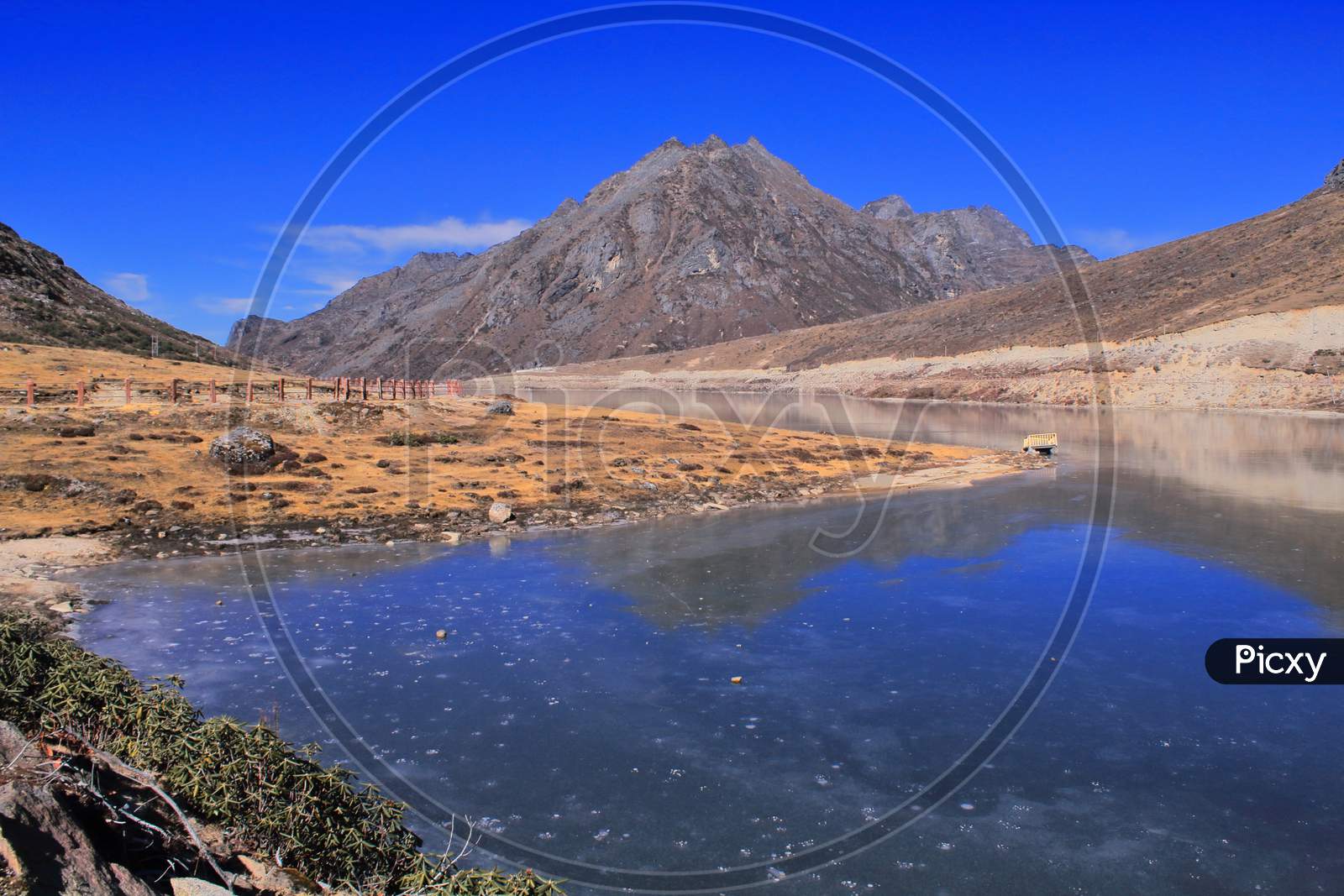 frozen sela lake with scenic alpine landscape, most popular tourist attraction of tawang the sela lake is located near sela pass in arunachal pradesh in india