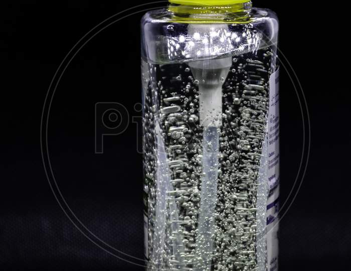 A Close Up View Of Hand Sanitizer In A Black Background