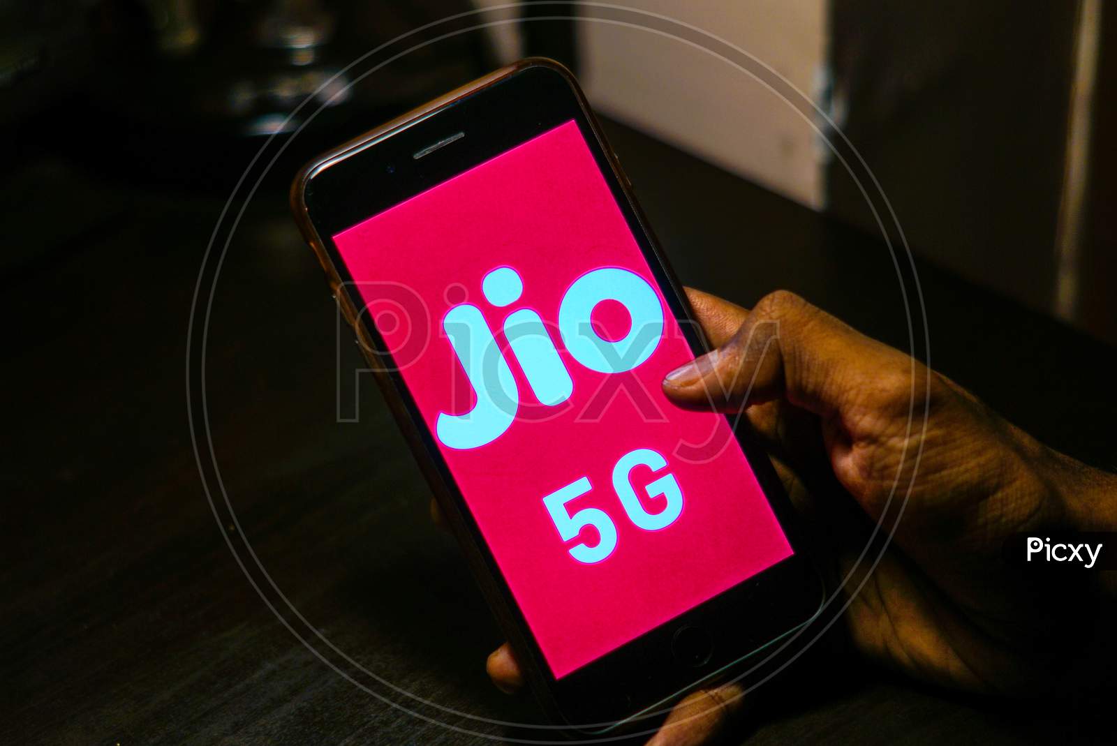 Close up shot of a Person using a Smartphone or Mobile Phone with Jio 5g on Screen
