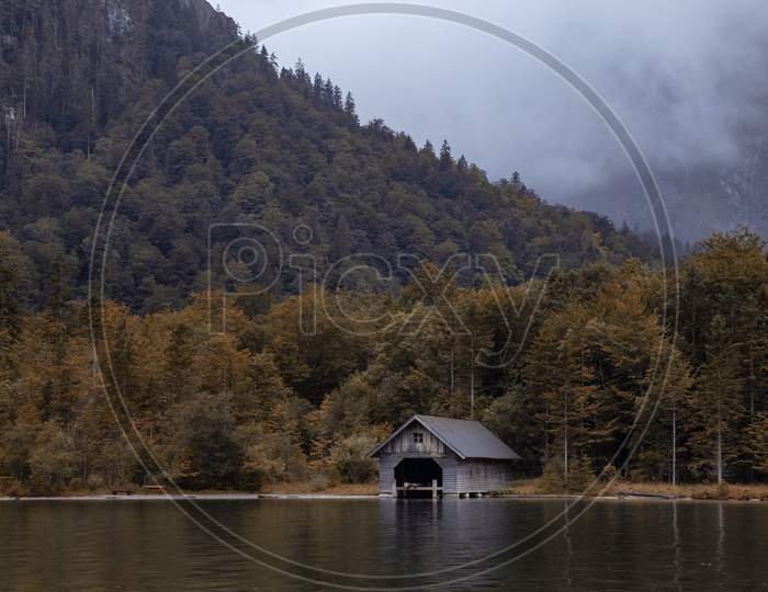 house on the lake with mountains