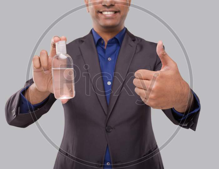 Businessman Showing Hands Sanitizer And Thumb Up Isolated Close Up. Business Man Holding Hand Antiseptic