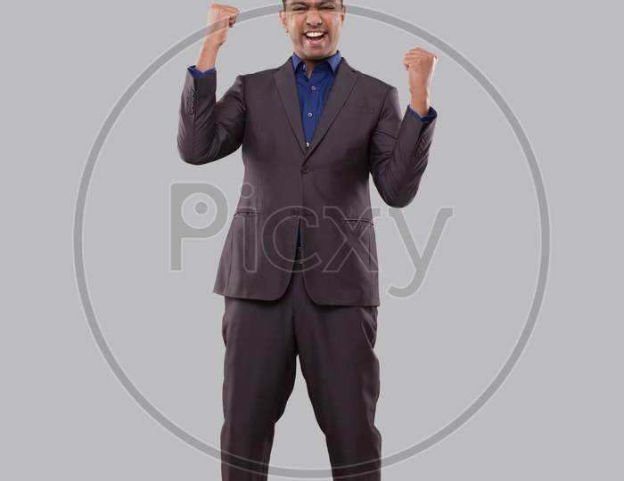 Businessman Very Happy And Excited, Raising Arms, Celebrating A Victory Or Success. Winner Sign. Indian Business Man Isolated