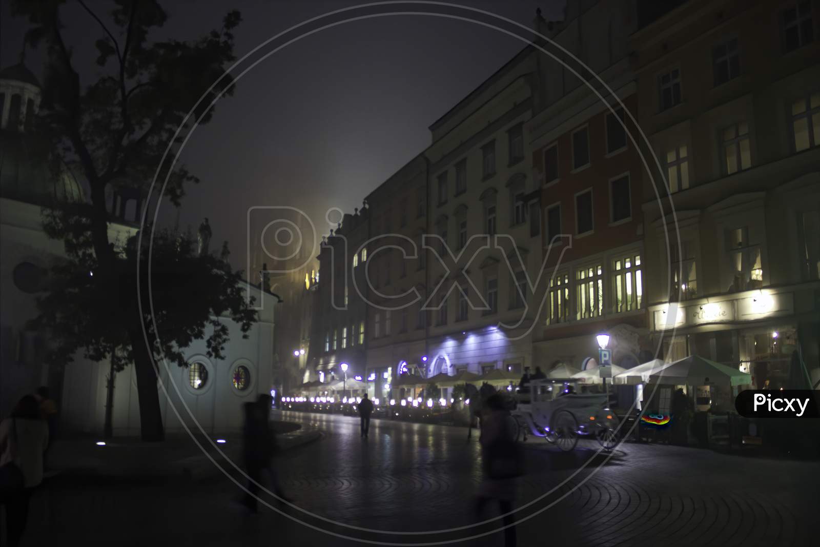 Krakow, Poland - October 29, 2014: Wide Angle View Of Main Square At Center In A Foggy Winter Night