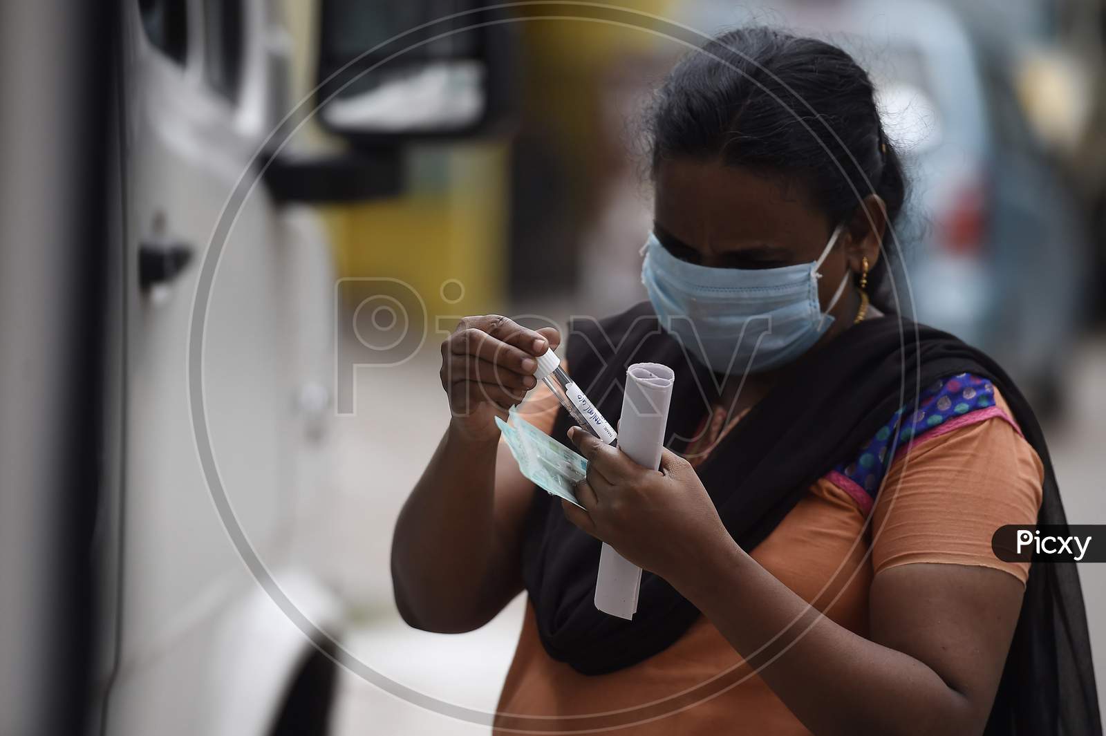 A health worker collects swab samples for Covid-19 testing in Chennai