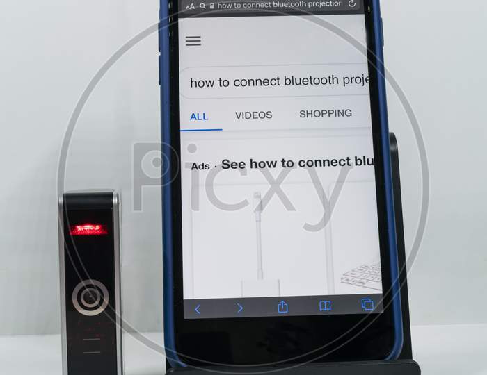 A Mobile Connected With Virtual Key Board, In White Background