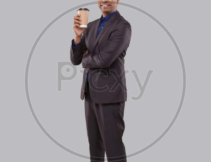 Businessman Holding Coffee To Go Cup Isolated. Indian Business Man With Coffee Take Away Cup In Hands