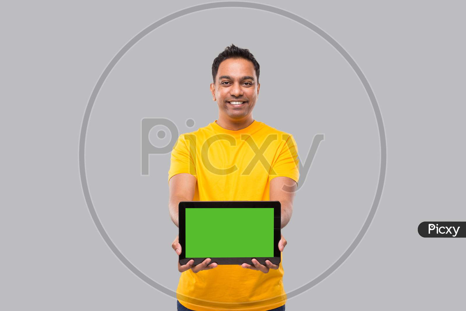 Indian Man Showing Tablet. Indian Boy With Tablet In Hands. Home Delivery, Technical Delivery