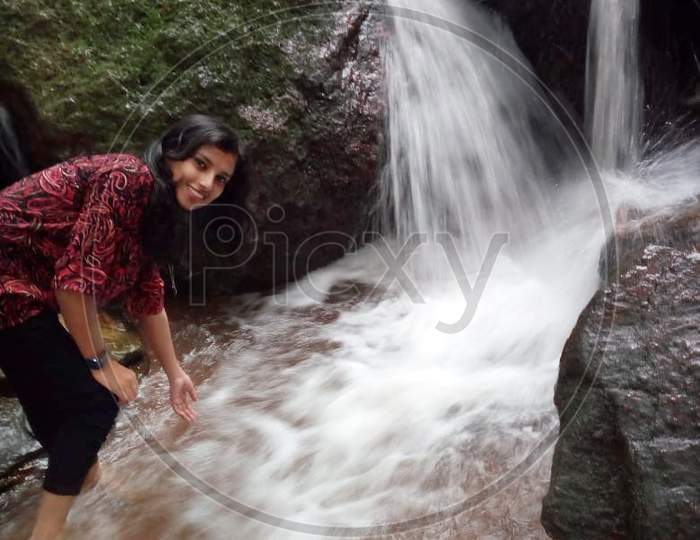 Girl at waterfall