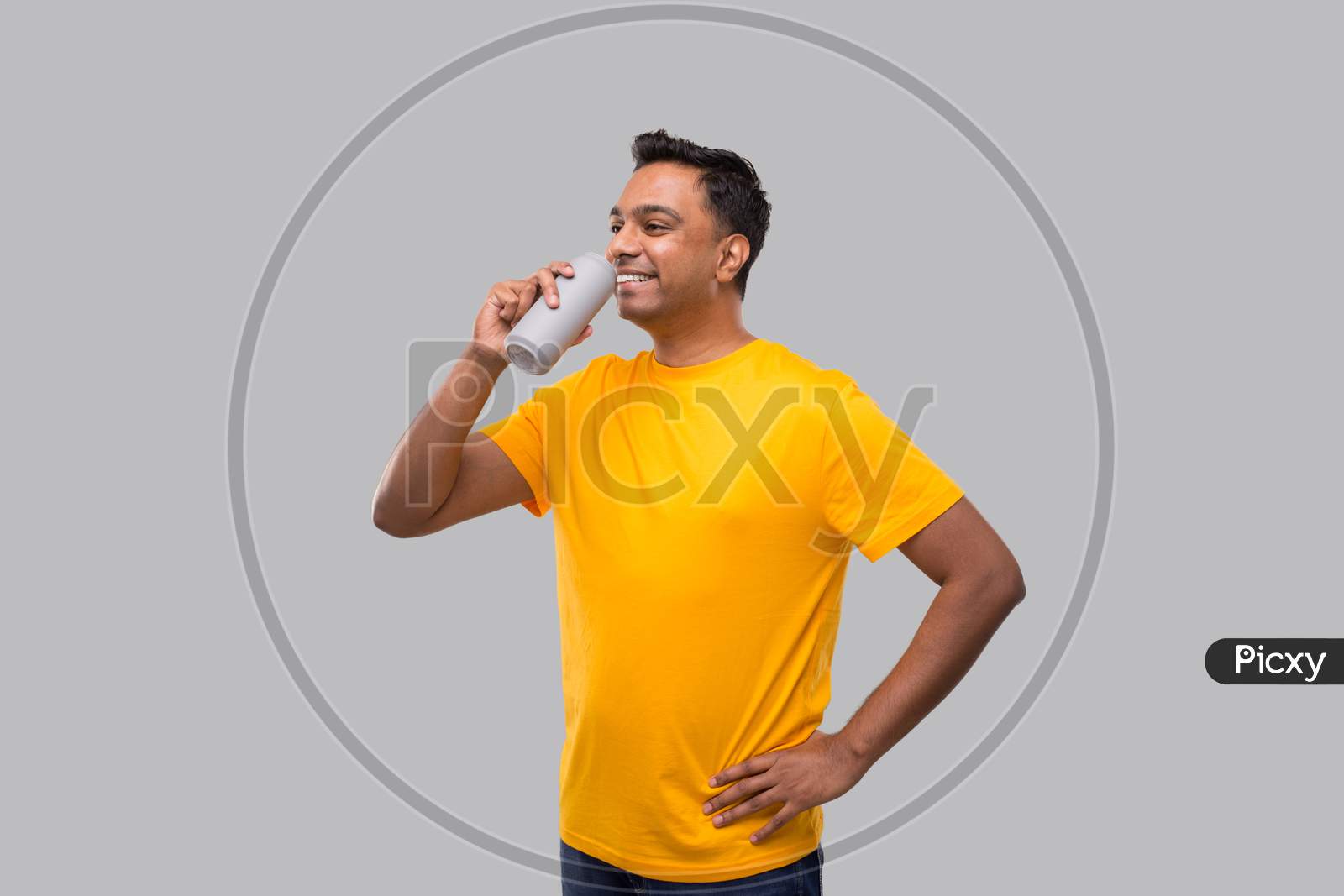 Indian Man Drinking From Tin Can Isolated.