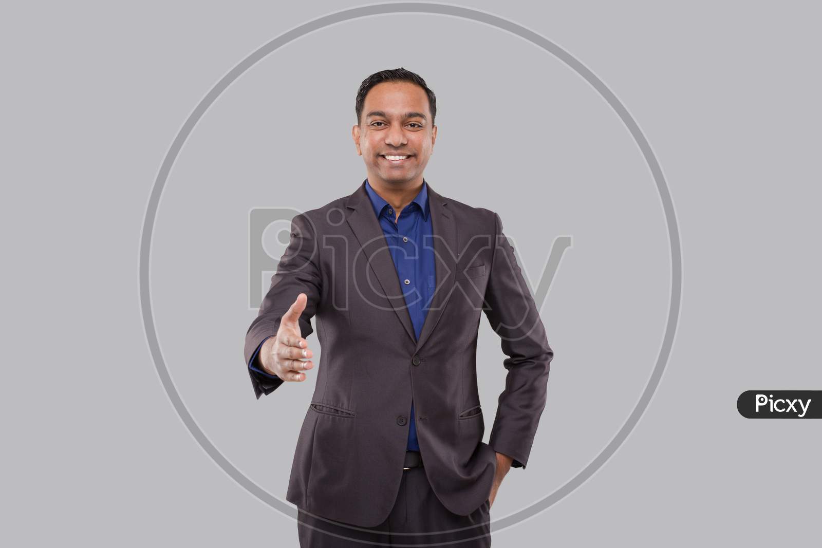 Indian Male Businessman Offering Hand To Shake. Greeting And Welcoming Gesture. Business Advertisement Concept. Businessman Hand Shake