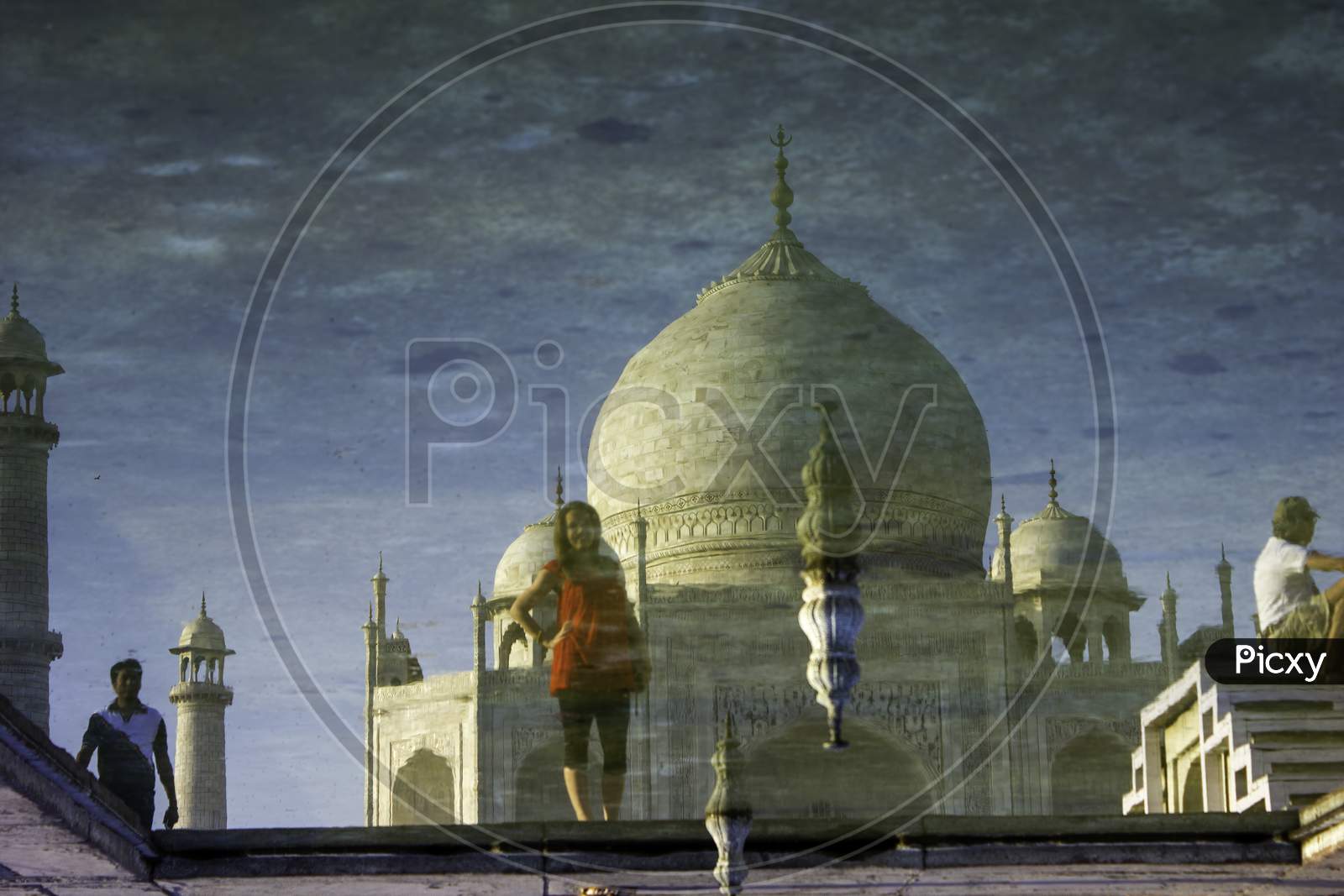 Agra, India - April 10,2014: Abstract Shot Of Tajmahal And Tourists Reflection In The Fountain Pond Filler With Water