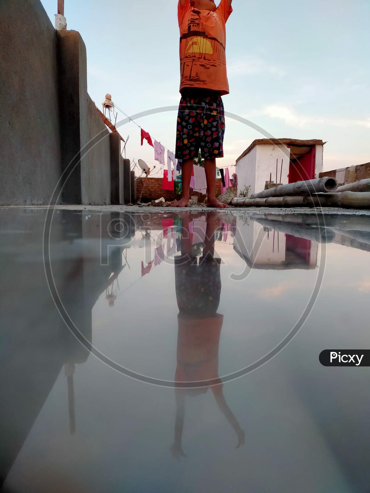 Reflection of a child in water