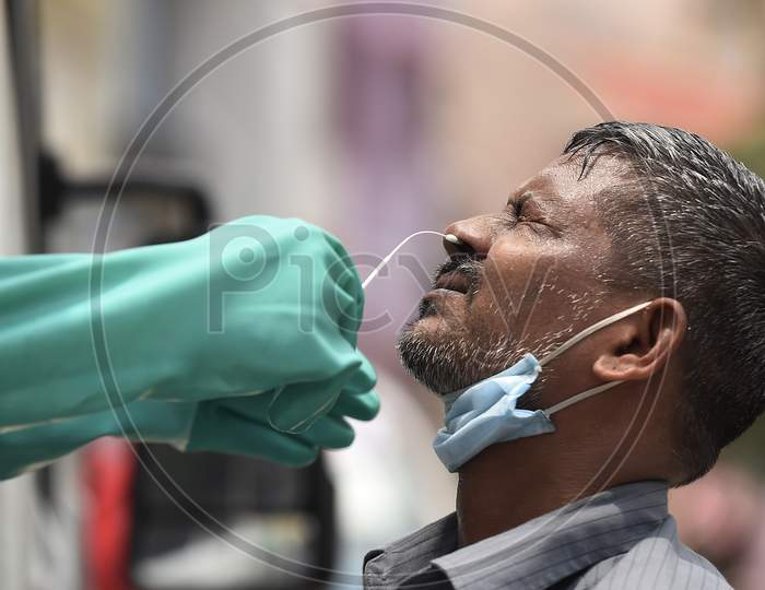 A health worker collects swab samples for Covid-19 testing in Chennai
