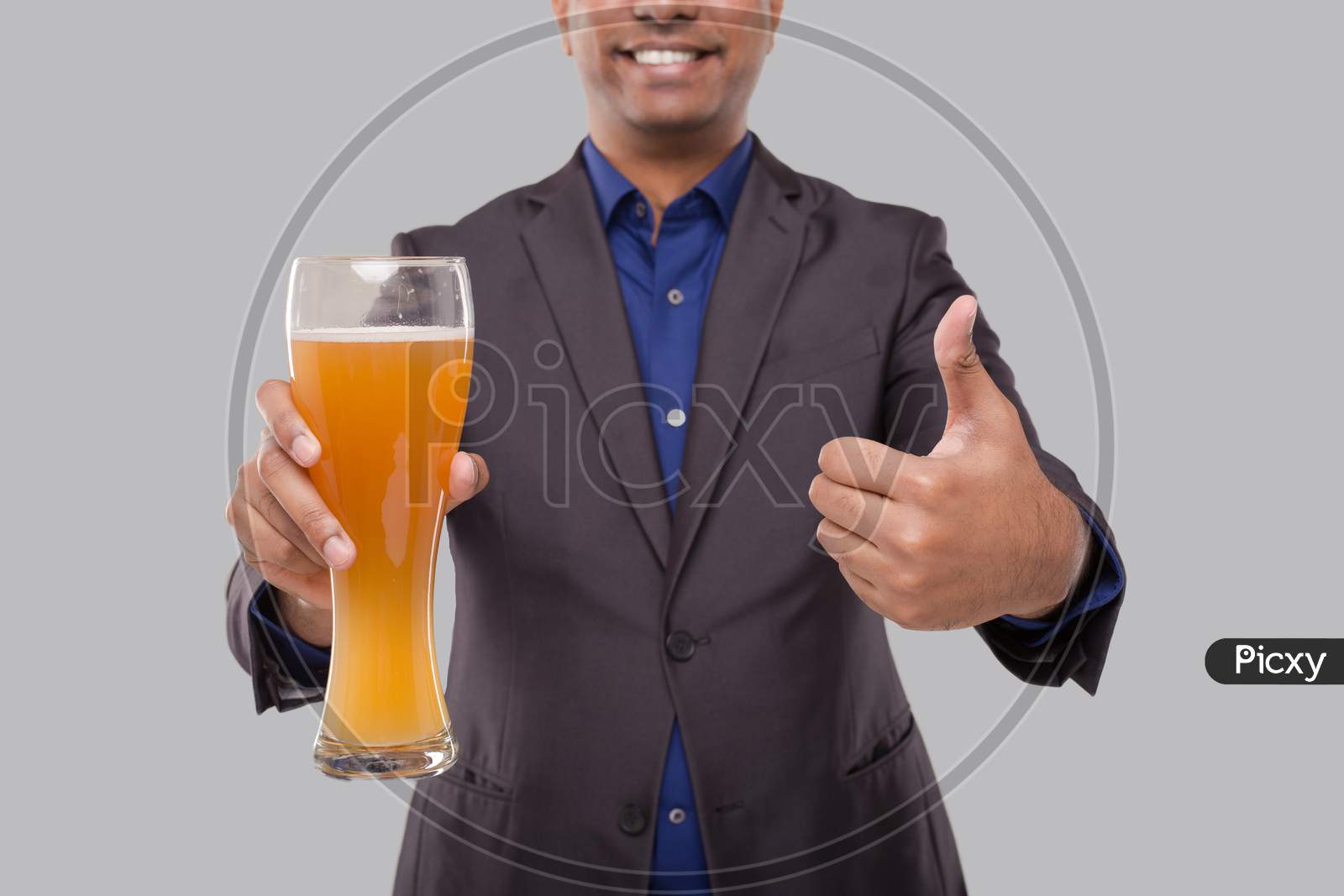 Businessman Showing Beer Glass And Thumb Up. Indian Business Man With Beer In Hand Close Up