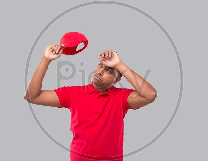 Delivery Man Tired After Work. Indian Delivery Boy Tired Sign. Red Uniform