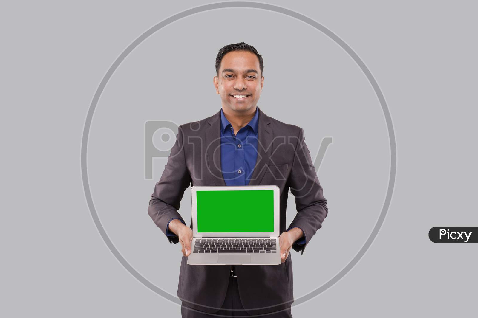 Businessman Showing Laptop Green Screen Isolated. Indian Business Man With Laptop In Hands. Online Business Concept