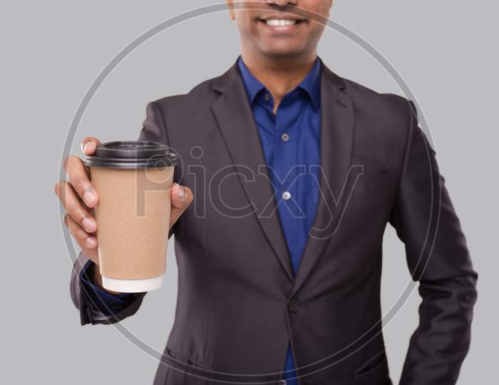 Businessman Holding Coffee To Go Cup Isolated Close Up. Indian Business Man With Coffee Take Away Cup In Hands