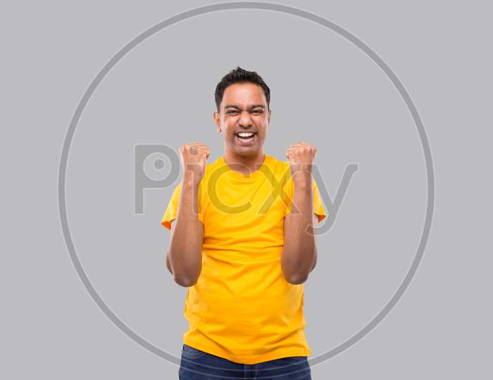 Indian Man Very Happy And Excited, Raising Arms, Celebrating A Victory Or Success. Winner Sign. Indian Man Isolated