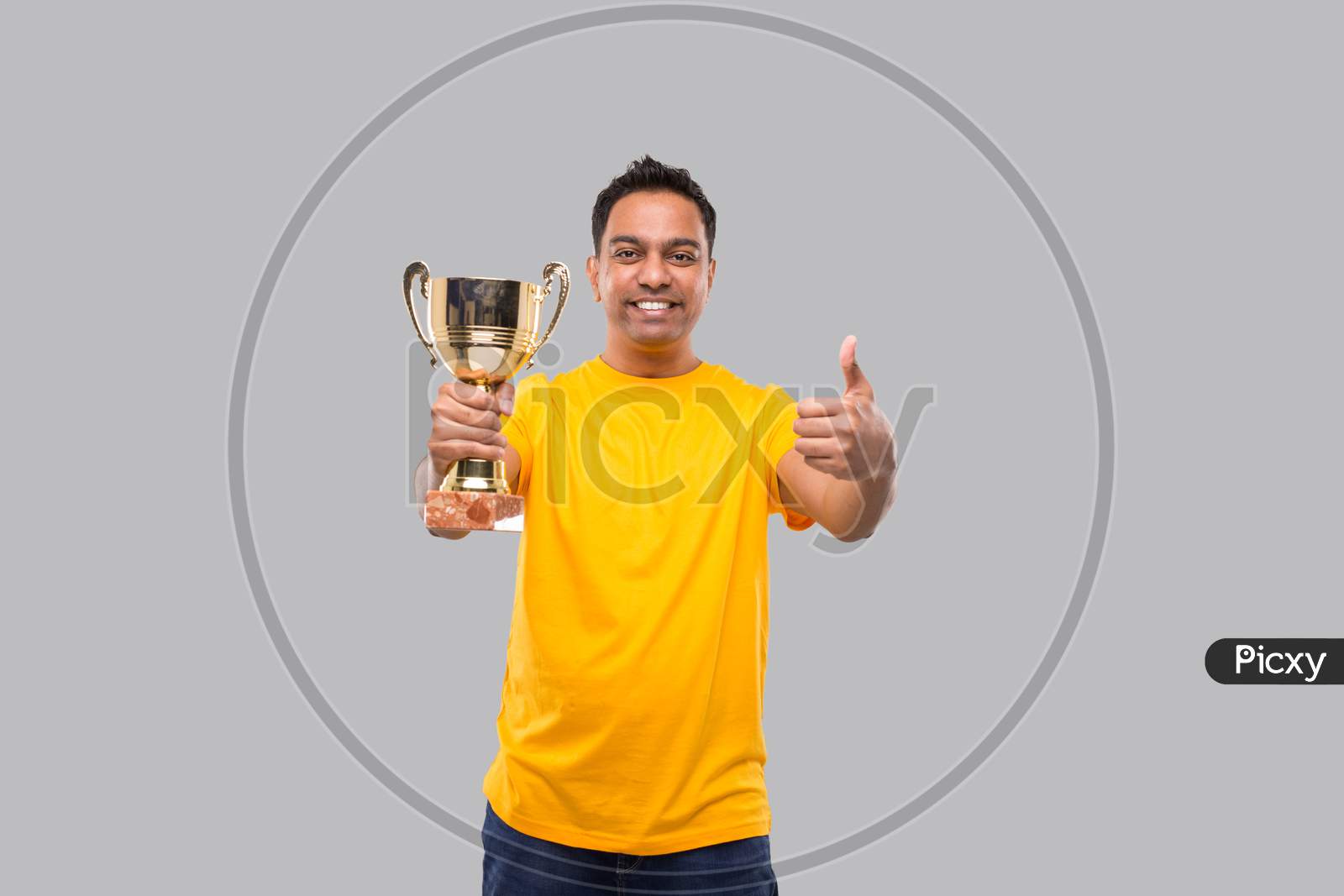 Indian Man Holding Trophy Showing Thumb Up Isolated Smilling
