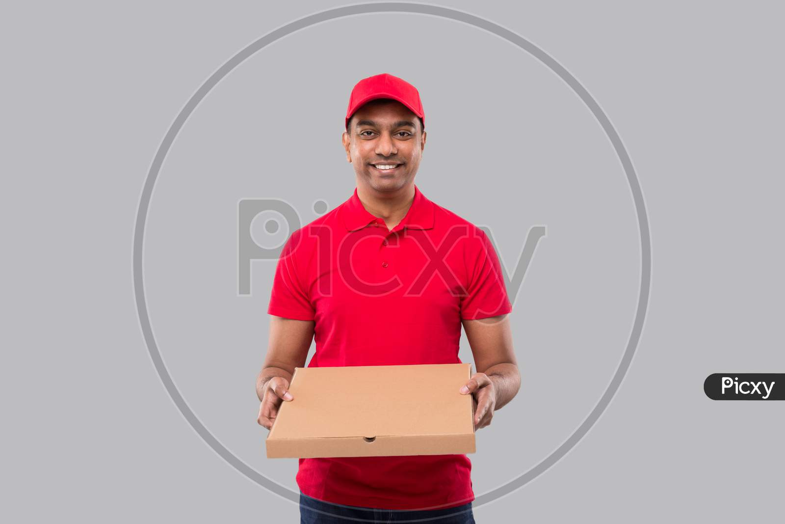 Delivery Man Pizza Box In Hands Isolated. Red Tshirt Indian Delivery Boy.