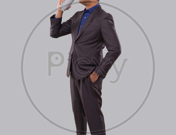 Businessman Drinking Beer From Tin Can. Indian Businessman Standing Full Length.