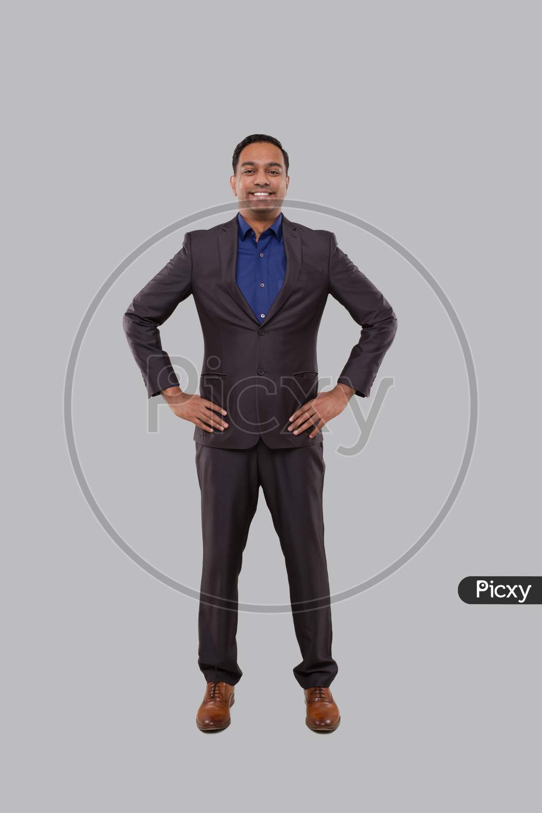 Businessman Smilling Hands To Sides Isolated. Indian Businessman Standing Full Length