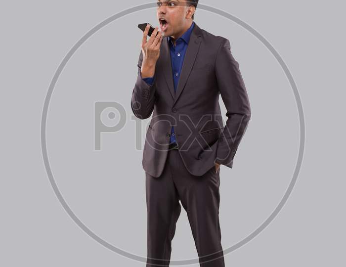 Businessman Angry Talking On Phone Isolated. Indian Businessman Yelling On Phone Standing Full Length