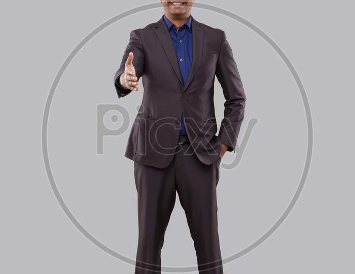 Indian Male Businessman Offering Hand To Shake. Greeting And Welcoming Gesture. Business Advertisement Concept. Businessman Hand Shake Full Lenght