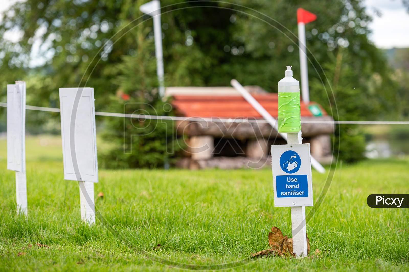Hand Sanitiser And Covid-19 Reminder Sign At An Outdoor Horse Trials Event