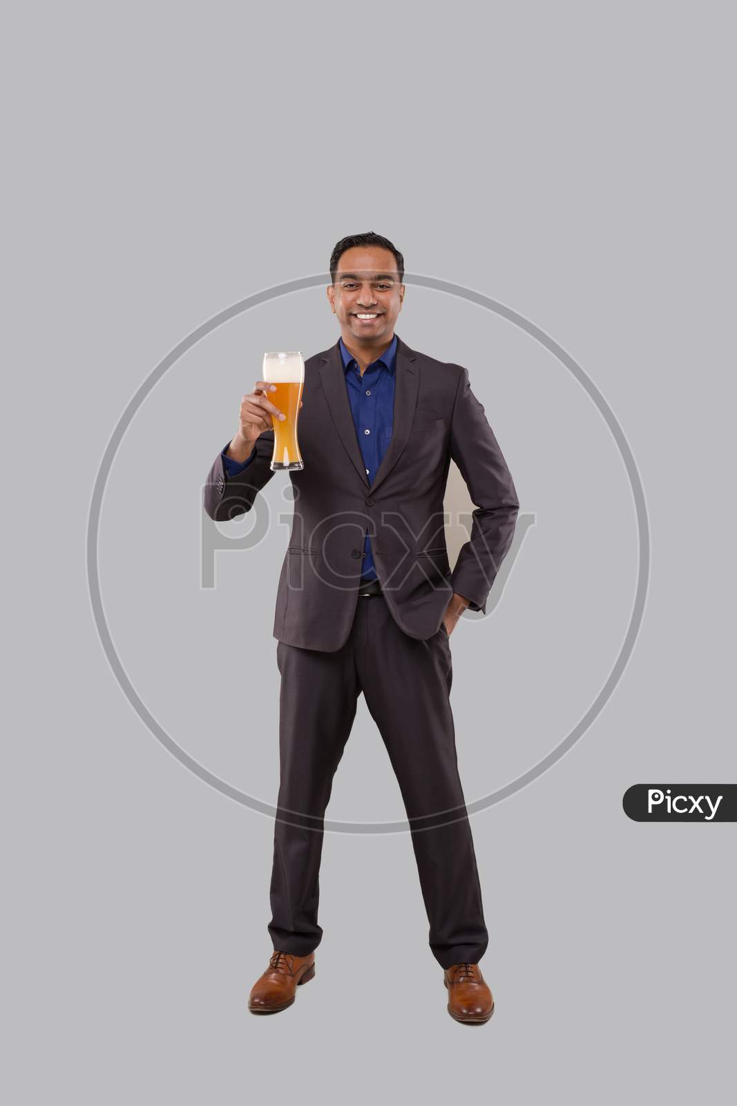 Businessman Holding Beer Glass. Indian Business Man Standing Full Length With Beer In Hand