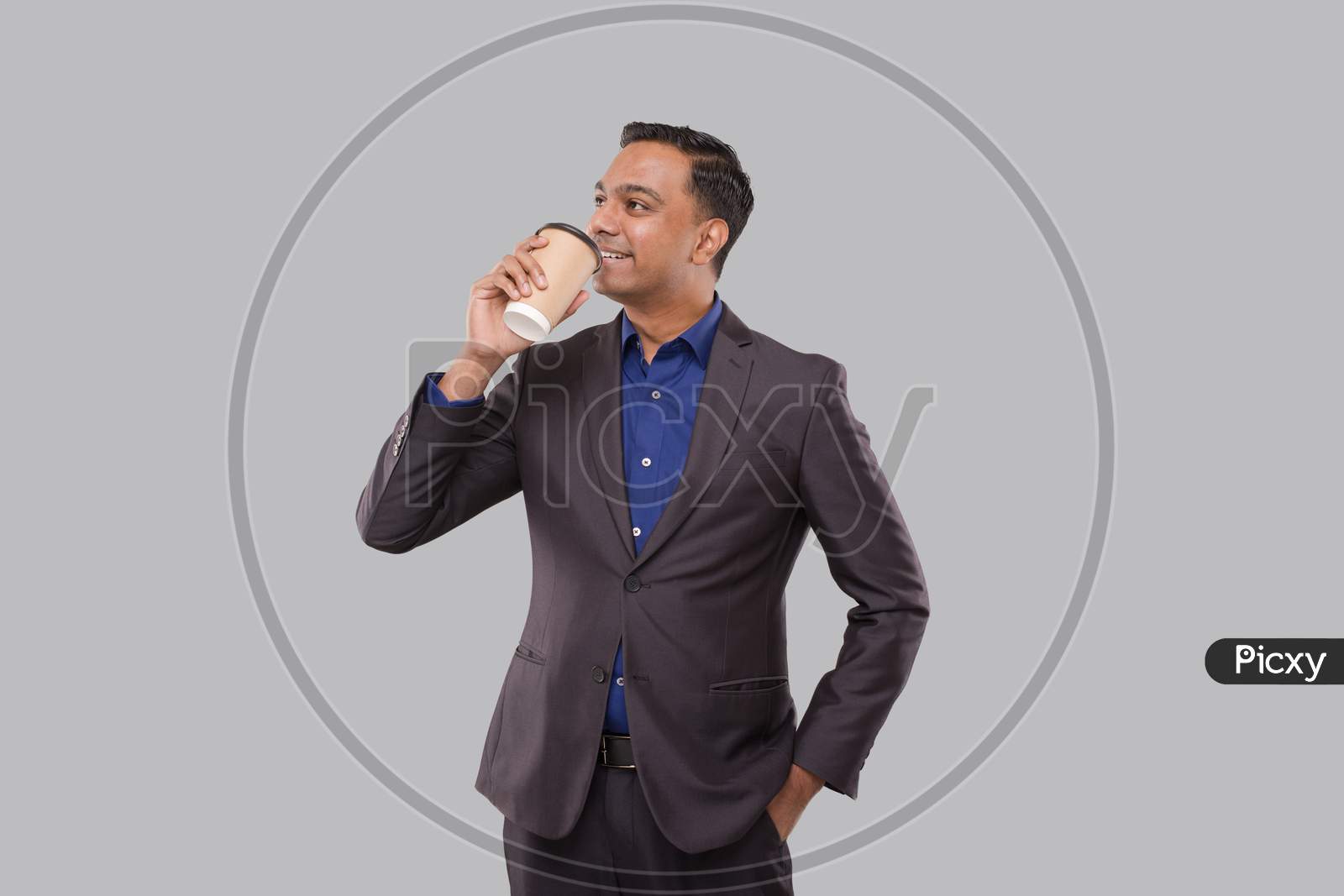 Businessman Drinking Coffee From To Go Cup Isolated. Indian Business Man With Coffee Take Away Cup In Hands