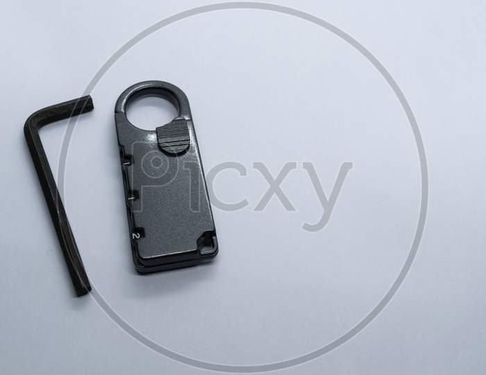 A Lock And L Key On A Plain White Background. Selective Focus, Selective Focus On Subject,