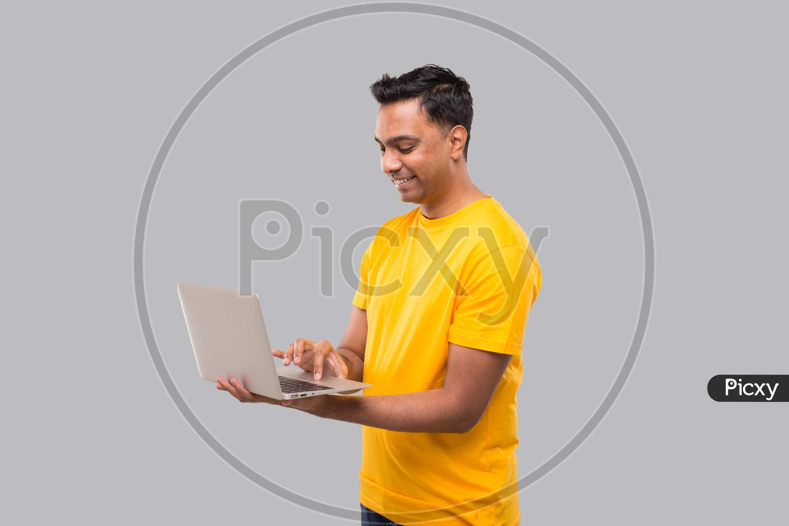 Indian Man Using Laptop. Home Orders, Quarantine Delivery, Shopping Online, Freelance Worker Concept.