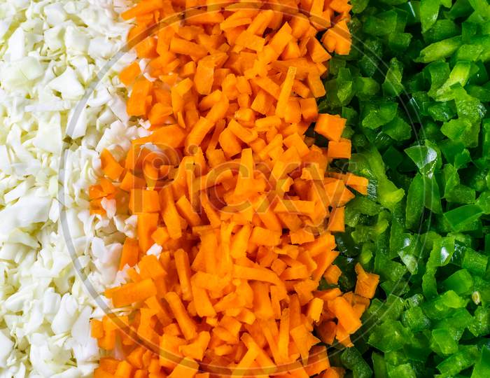Chopped Cabbage, Carrot And Green Capsicum Nicely Arranged In Plate