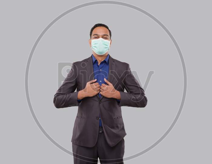 Businessman Standing In Business Pose Wearing Medical Mask Isolated. Indian Business Man Standing Isolated