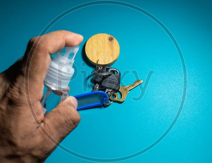 Cleaning Keys With Sanitizer To Prevent From Corona Virus, Covid 19