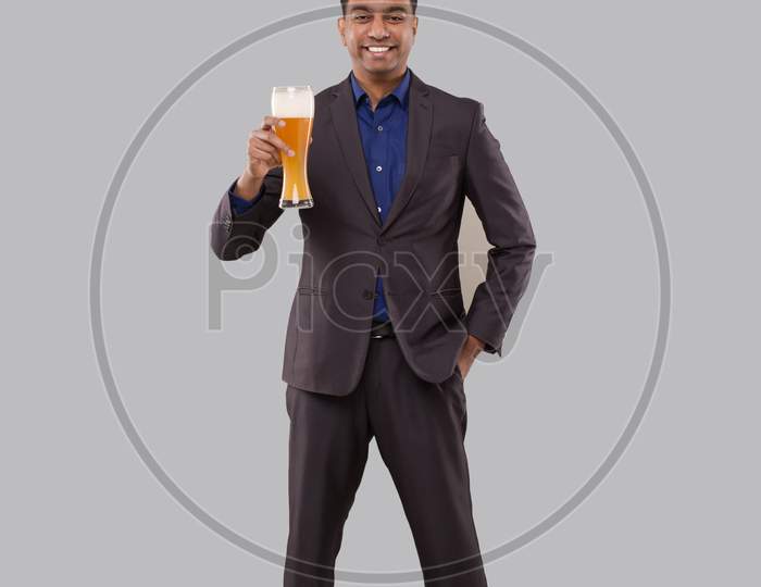 Businessman Holding Beer Glass. Indian Business Man Standing Full Length With Beer In Hand
